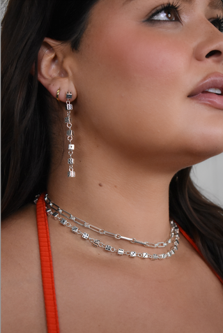 Bella is wearing the ceo chain at choker length